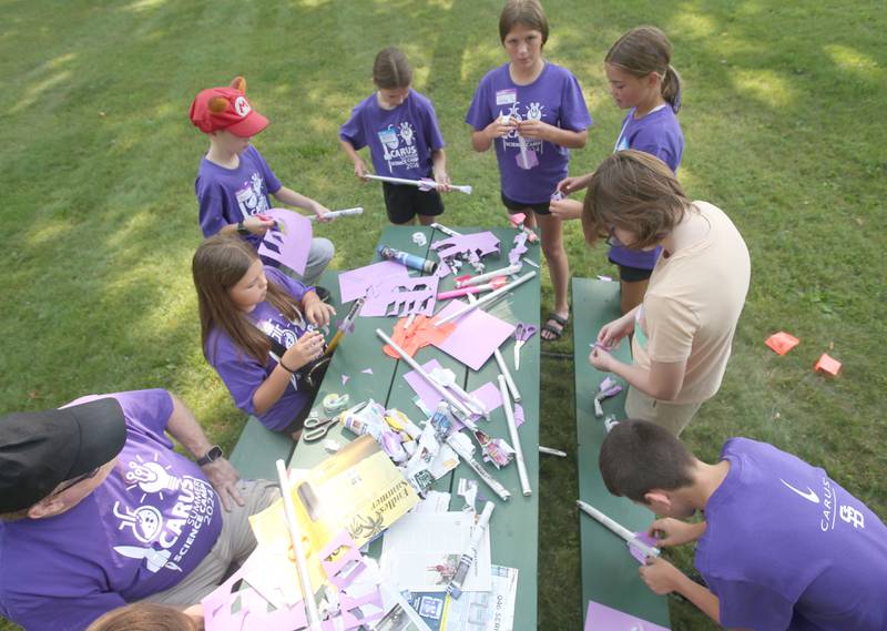 Kids build homemade rockets during the 22nd annual Carus Summer Science Camp on Friday, July 12, 2024 at St. Bede Academy.