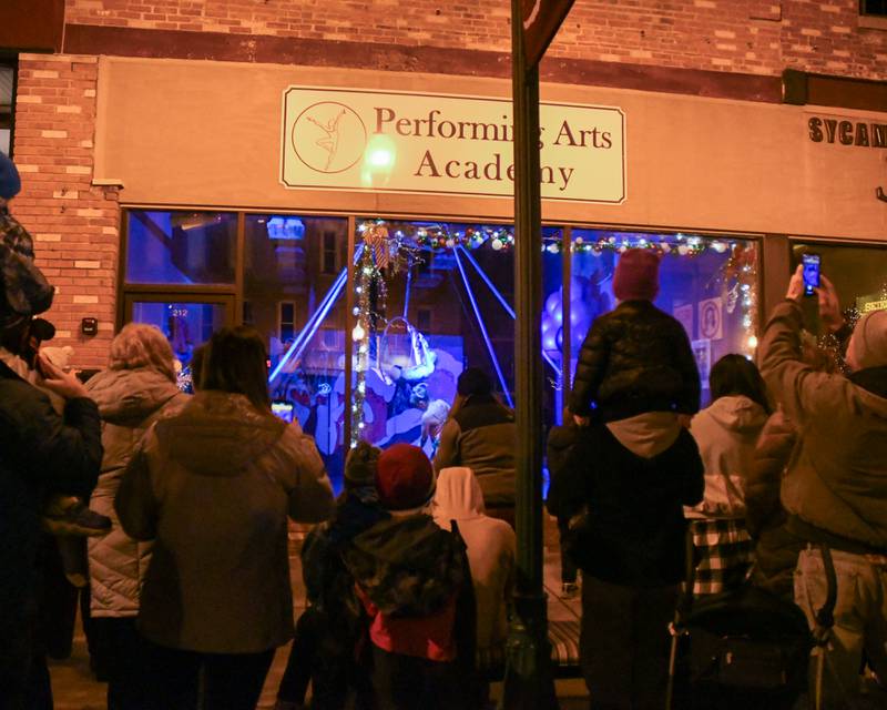 Community members watch dancers from the Performing Arts Academy during the Moonlight Magic event held in downtown Sycamore on Friday Nov. 17, 2023.