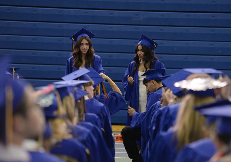 Lyons Township students (left) Nina Ivancevic of La Grange Park and Melanie Alneida of Hodgkins talk with their peers prior to their graduation ceremony Wednesday May 29, 2024.