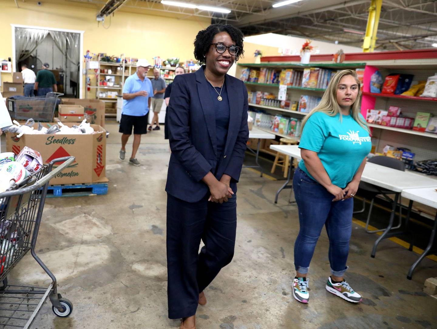 Dulce Vargas (right), assistant director of the Kendall County Food Pantry, gives a tour of the Yorkville facility to U.S. Rep. Lauren Underwood (left) on Monday, July 1, 2024. Congressman Underwood was there to present $763,500 for the pantry to rehabilitate the the facility including resurfacing the flooring, installing emergency pathway lighting and handicap entry doors.
