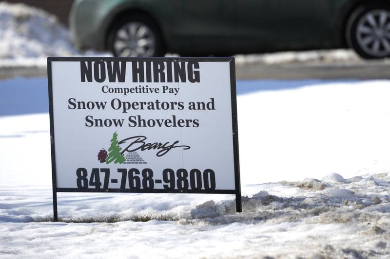 A hiring sign is displayed in Arlington Heights, Ill., Sunday, Feb. 5, 2022. On Thursday, the Labor Department reports on the number of people who applied for unemployment benefits last week. (AP Photo/Nam Y. Huh)