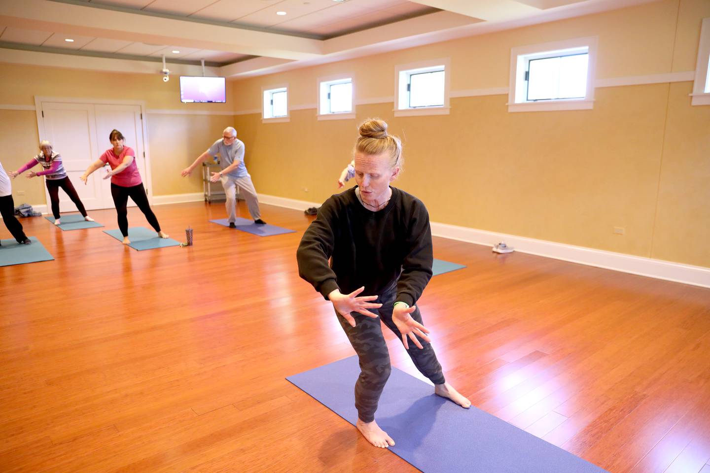 Erin Bloodworth, wellness coordinator at Northwestern Medicine Living Well Cancer Resource Center, leads a tai chi class for cancer patients, survivors and caregivers at the Geneva facility.