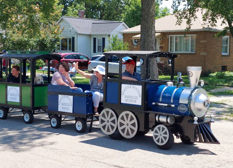 The Seattle Sutton Marseilles Museum train makes its way along the Fun Days parade route Sunday, July 9, 2023.