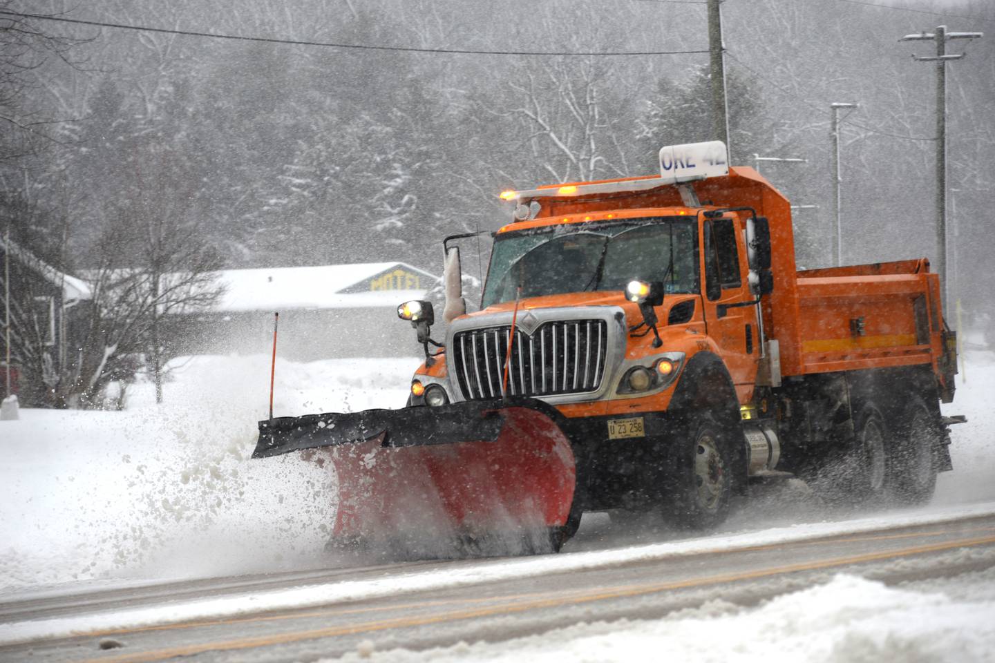 An Illinois Department of Transporation snow plow heads south on state Route 2, north of Oregon on Friday, Jan. 12, 2024. Crews were out the entire day trying to keep roadways passable. More snow was forecast throughout the night and into Saturday.