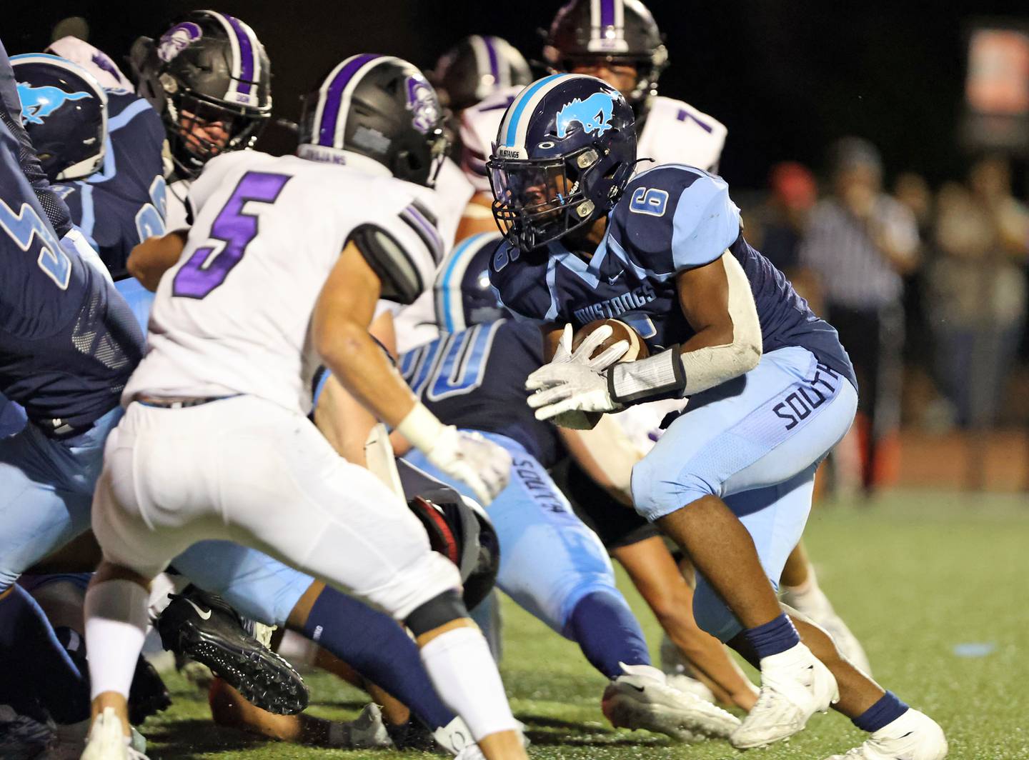 Downers Grove South’s Deon Davis (6) runs against Downers Grove North during the boys varsity football game on Friday, Sept. 1, 2023.