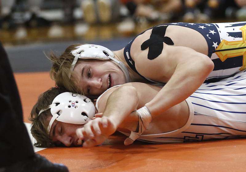 Yorkville Christian’s Ty Edwards tries to turn Burlington Central’s Doug Phillips during the 132-pound championship match of a the IHSA 2A Crystal Lake Central Wrestling Regional on Saturday, Feb. 3, 2024, at Crystal Lake Central High School.