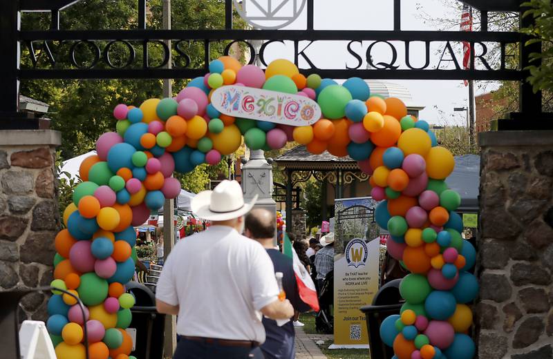 People walks onto the Historic Woodstock Square during the annual Hispanic Connections Mexican Independence Day Celebration on Sunday, Sept. 15, 2024. The celebration featured music, food and culture.