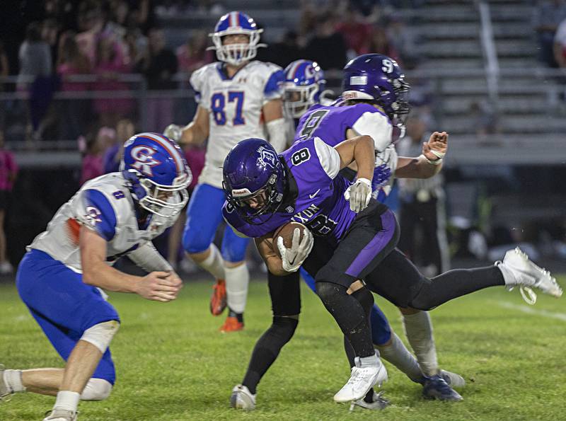 Dixon’s Tyson Dambman lowers his shoulder Thursday, Sept. 14, 2023 against Genoa-Kingston’s Nathan Kleba in a game at Dixon High School.