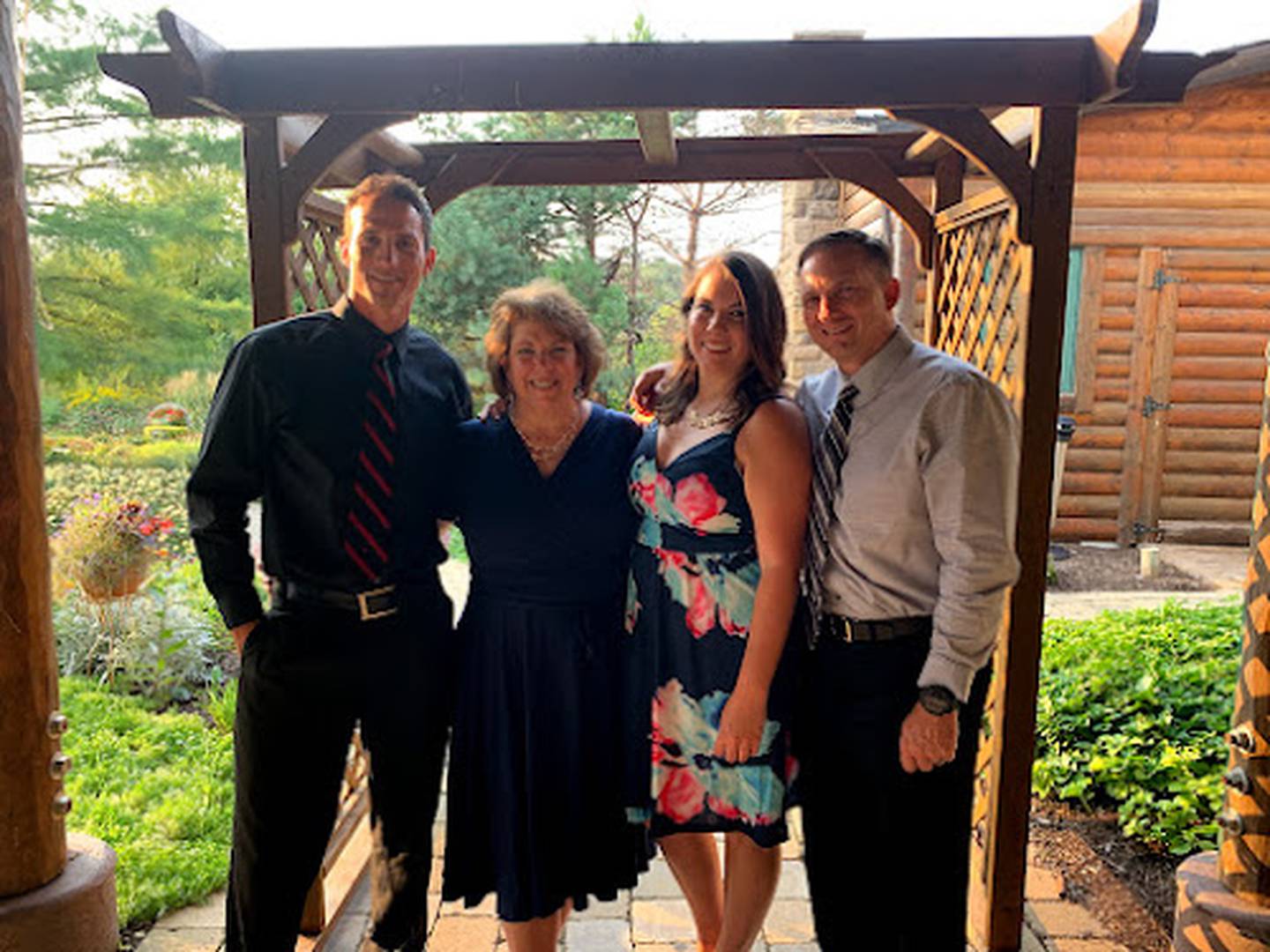 After overcoming battles with breast cancer and heart failure, labor and delivery nurse Nancy Polizzi of Montgomery, second from left, is grateful for being given new life so that she can continue to bring new life into the world. Here she is surrounded by her family.