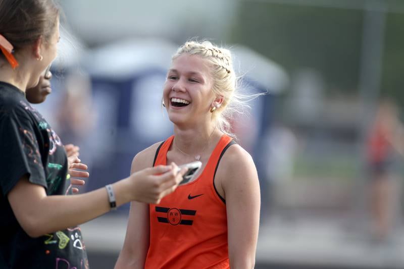 Wheaton Warrenville South’s Haylie Hinckley smiles after her jump in the high jump competition during the Class 3A Metea Valley girls track and field sectional on Thursday, May 11, 2023.