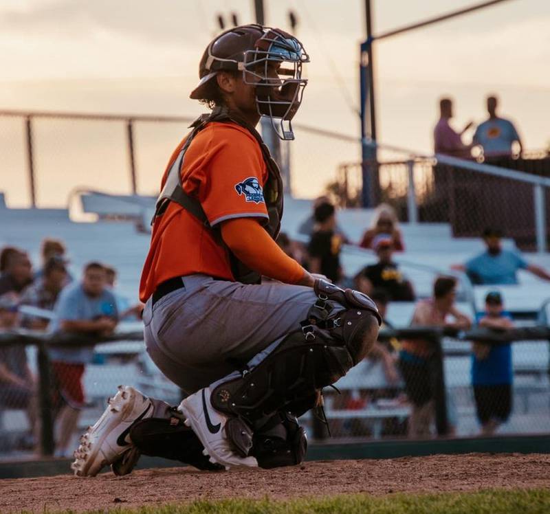 Brandon Mahler sets up behind the plate during the Illinois Valley Pistol Shrimp's 4-2 loss to the Burlington Bees on Friday, June 14, 2023 in Burlington, Iowa.