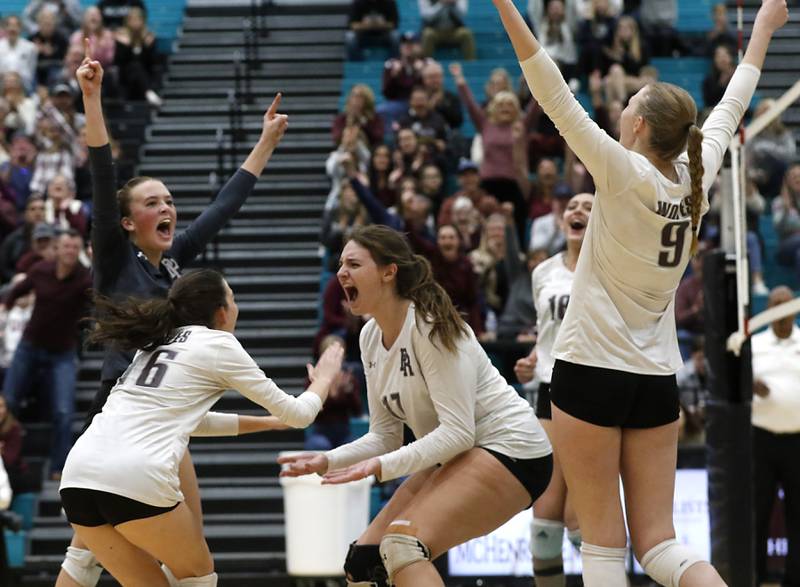 Prairie Ridge's Alli Rogers, \(left to right) Julia Reina, Mackenzie Schmidt, Maizy Agnello, and Amelia Bowen celebrate a point as they make a come back during the second game of the Class 3A Woodstock North Sectional finals volleyball match against Belvidere North on Wednesday, Nov. 1, 2023, at Woodstock North High School.