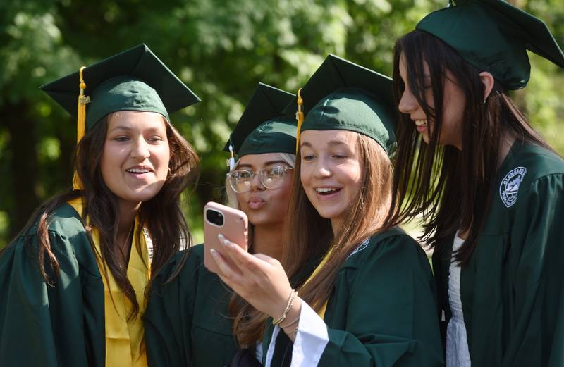 Graduates take a photo prior to the start of the Glenbard West graduation ceremony on Thursday, May 23, 2024 in Glen Ellyn.