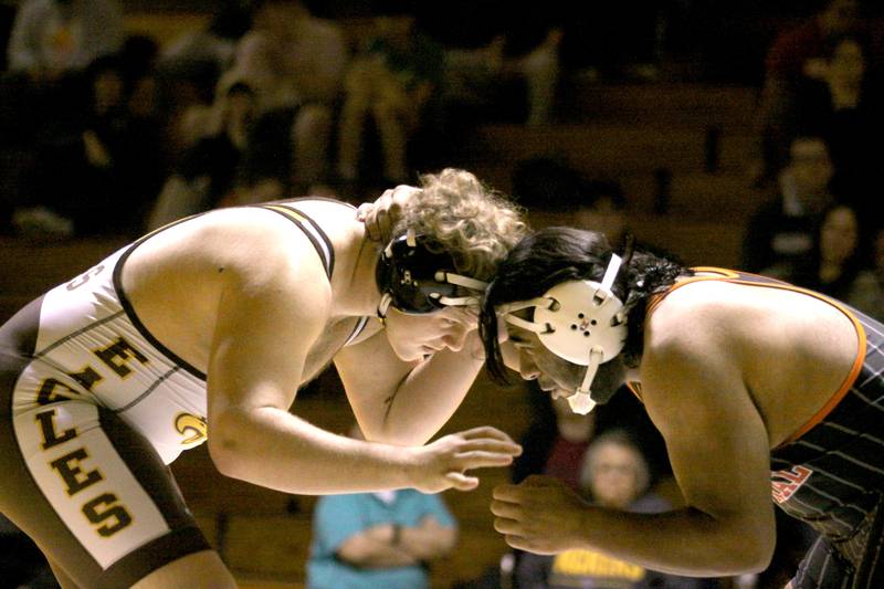 Jacobs’ Rocco Sauer battles Crystal Lake Central’s Leo Diaz at 285 pounds in varsity wrestling Thursday at Algonquin.