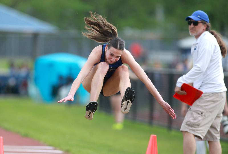 Geneva’s Reilly Day competes in the long jump during the DuKane Conference Girls Outdoor Championships at Lake Park in Roselle on Thursday, May 2, 2024.