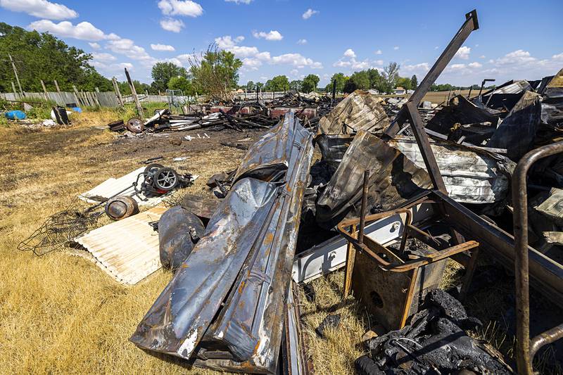 A metal coffin signed by an actor who played the iconic “Leatherface” in a movie sequel sits twisted and damaged from the fire Thursday, May 23, 2024.