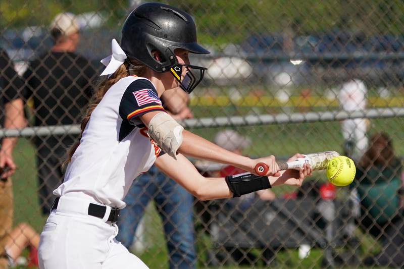 Batavia's Emily Reagan (4) lays down a bunt against Geneva during a softball game at Batavia High School on Wednesday, May 8, 2024.