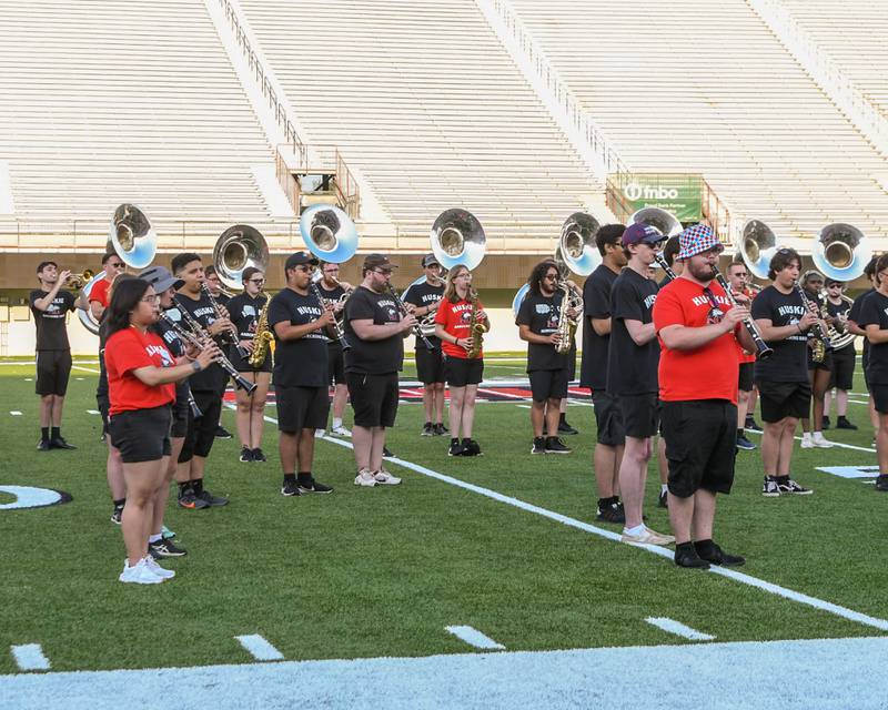 Members of Northern Illinois University's marching band kick off with the national anthem to start of the Drum Corps International Midwest Classic on Saturday, July 13, 2024, at Northern Illinois University Huskie Stadium in DeKalb.