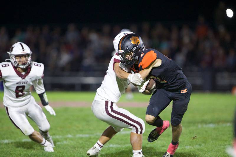 Crystal Lake Central's Cody Coleman looks to run the ball for a gain against Prairie Ridge on Friday, Oct.18, 2024 in Crystal Lake.