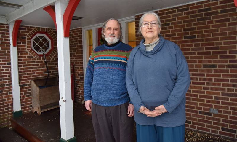 Jeff Jens and Ann Boisclair pose at their home tucked into the woods in Glen Ellyn. They have donated to several solar initiatives.