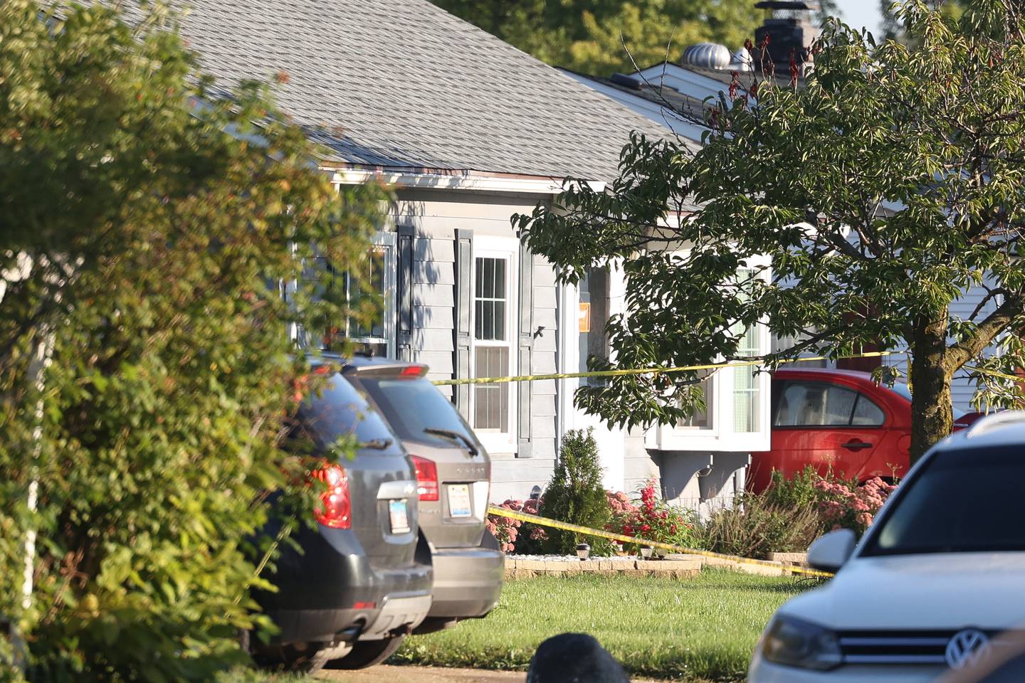 Police tape blocks off a home on the 500 block of Concord Avenue where police found the bodies of two adults and two children with gunshot wounds on Monday, Sept. 18, in Romeoville.