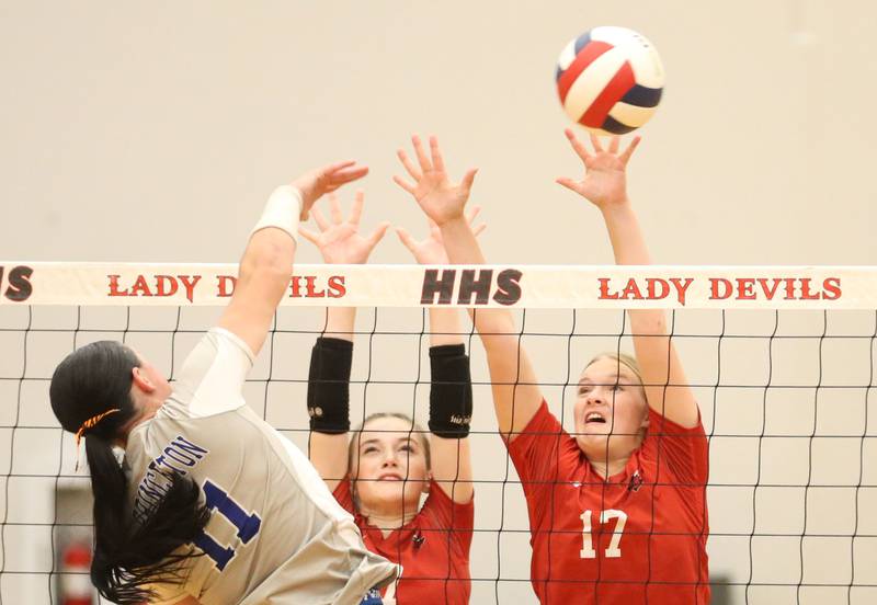 Princeton's Keely Lawson sends a kill past Hall's Charlie Pellegrini and teammate Caroline Morris on Tuesday, Sept. 17, 2024 at Hall High School.