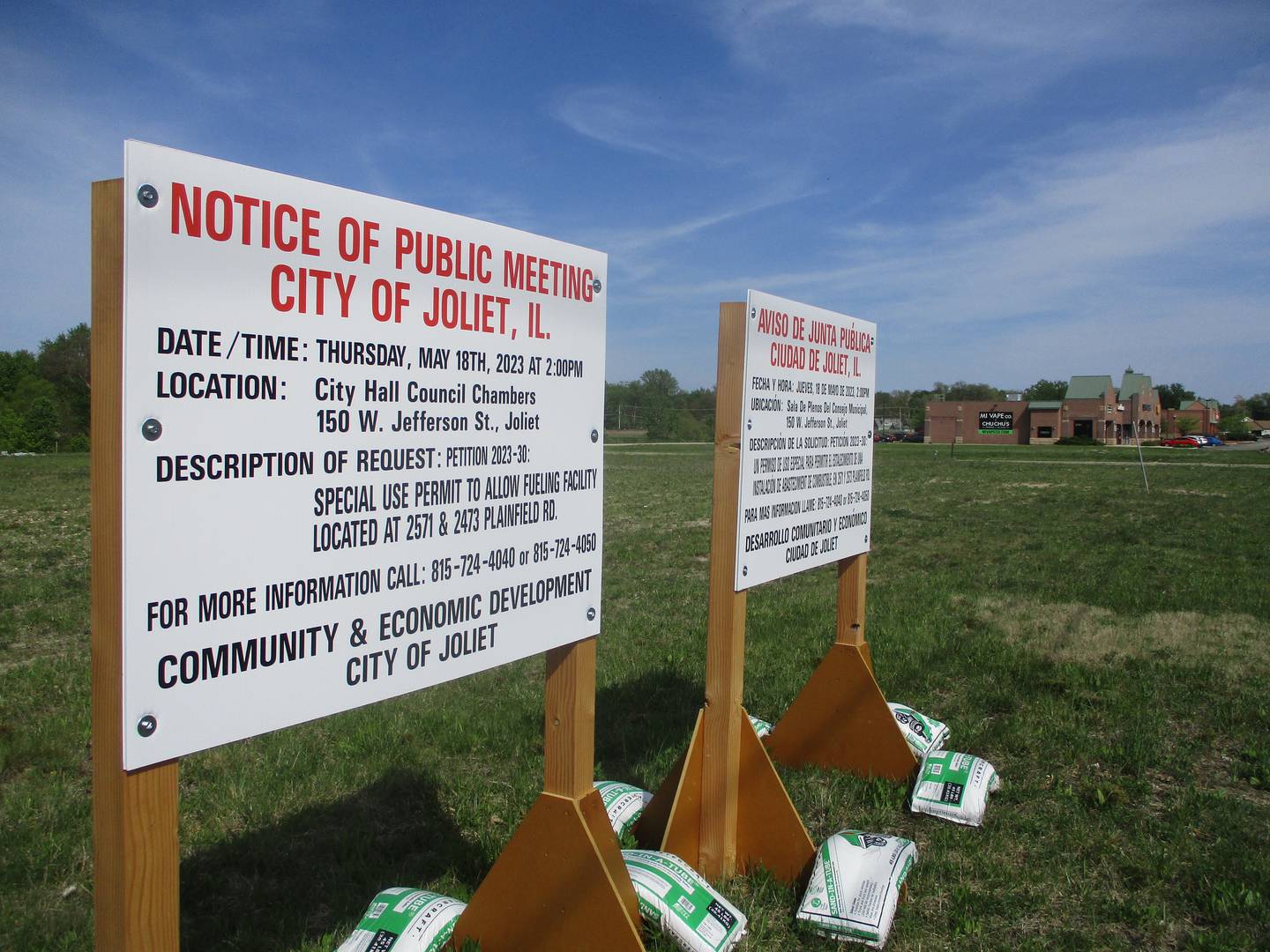 Posted signs give notice of Joliet Zoning Board of Appeals hearing for auto-truck fueling center proposed for site west of the Millennium Square commercial development. May 11, 2023.