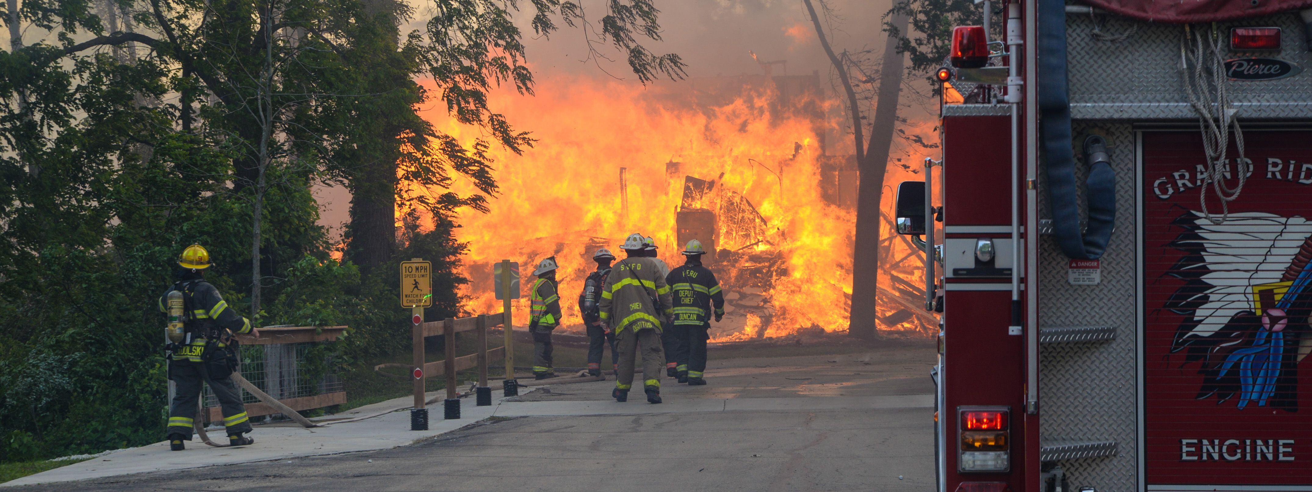 Firefighters head into a blaze Monday, May 30, 2022, at Grand Bear Resort in Utica. The fire was a five-alarm fire.