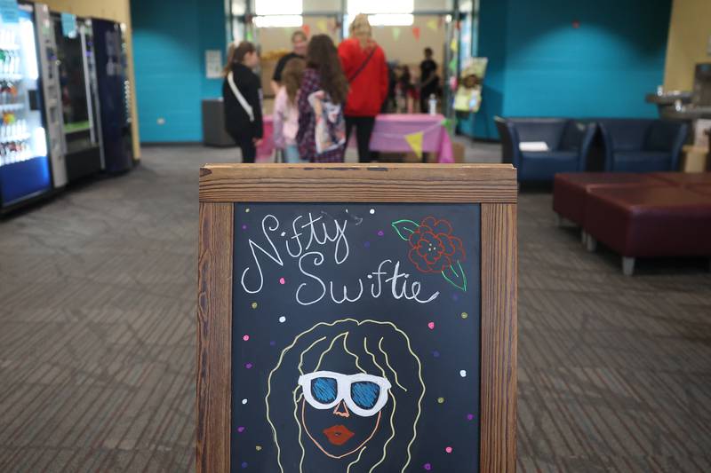 A family checks in at the Taylor Swift fan party hosted by the Lockport Township Park District on Saturday, Feb. 10, 2024 in Lockport.