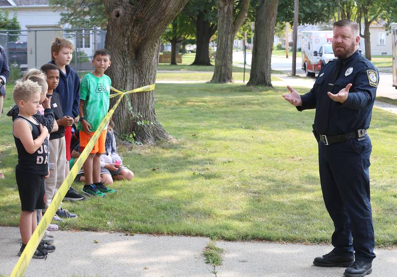 Peru Police officer Brian Zebron speaks to students about 9/11 on Wednesday, Sept. 11, 2024 at Circuit Breaker School in Peru.