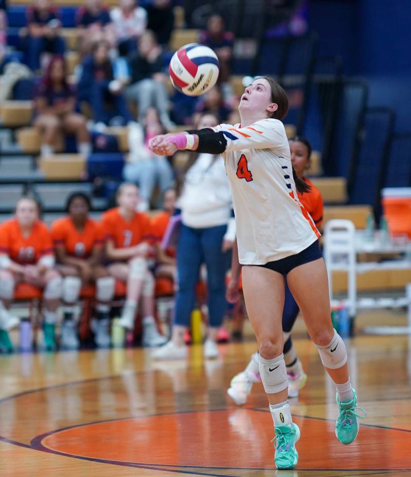 Romeoville's Alexis Crowley (4) bump sets the ball against Oswego during a volleyball game at Oswego High School on Tuesday, Oct. 17, 2023.