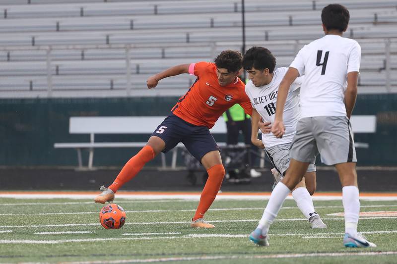 Romeoville’s Josh Silvar works the ball against Joliet West on Wednesday, Oct. 11, 2023 in Romeoville.