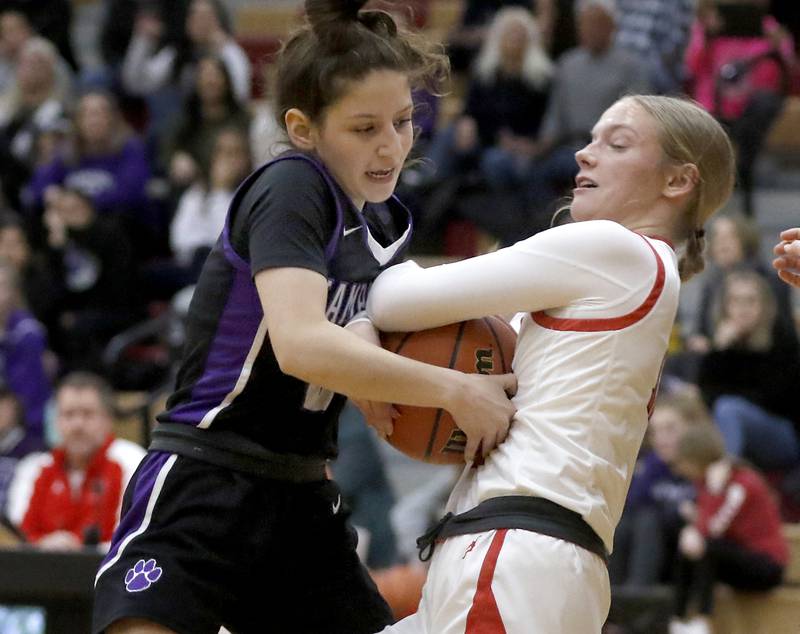 Hampshire's Alex Montez and Huntley's Morgan McCaughn battle for a rebound during a Fox Valley Conference girls basketball game Monday, Jan. 30, 2023, at Huntley High School.