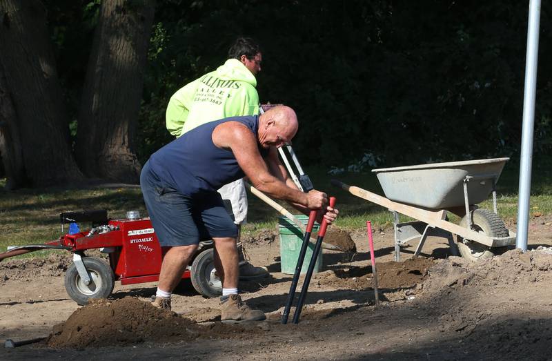 Workers from Illinois Valley Fence and Pool are building a new fence around the perimeter of the baseball field on Wednesday, Sept. 18, 2024 at Sunset Park in Peru.