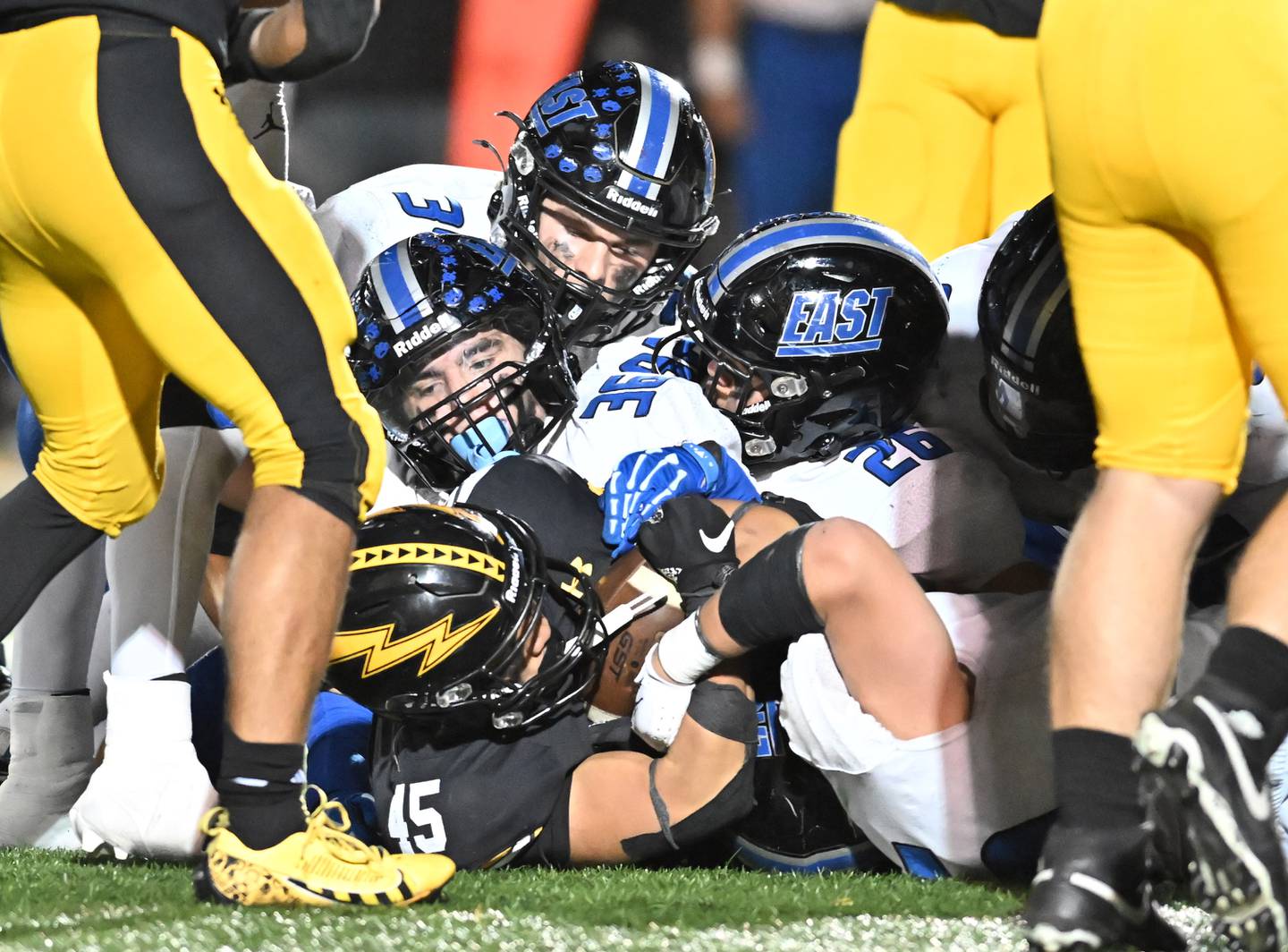 Andrew's Brady Tanquilut (45) get gang tackled during a non-conference game against Andrew on Friday, Oct. 18, 2024, at Tinley Park. (Dean Reid for Shaw Local News)