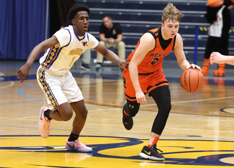 DeKalb’s Sean Reynolds drives by Warren's Jaxson Davis Tuesday, Feb. 27, 2024, during their Class 4A sectional semifinal game at Rock Valley College in Rockford.