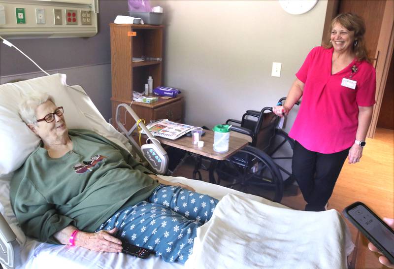 Maretta "Mikki" Bell, 78, one of the first residents to move into the DeKalb County Rehabilitation and Nursing Center’s new transitional care wing, talks to Mary Anne Miller, social service director at the facility, Wednesday, July 10, 2024, about what she likes about the rooms in the new addition.