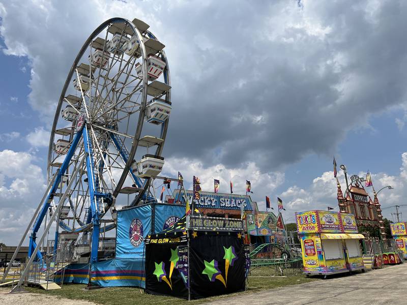 A ferris wheel and other amusement rides for the Taste of Joliet on Thursday, June 20, at Joliet Memorial Stadium in Joliet.