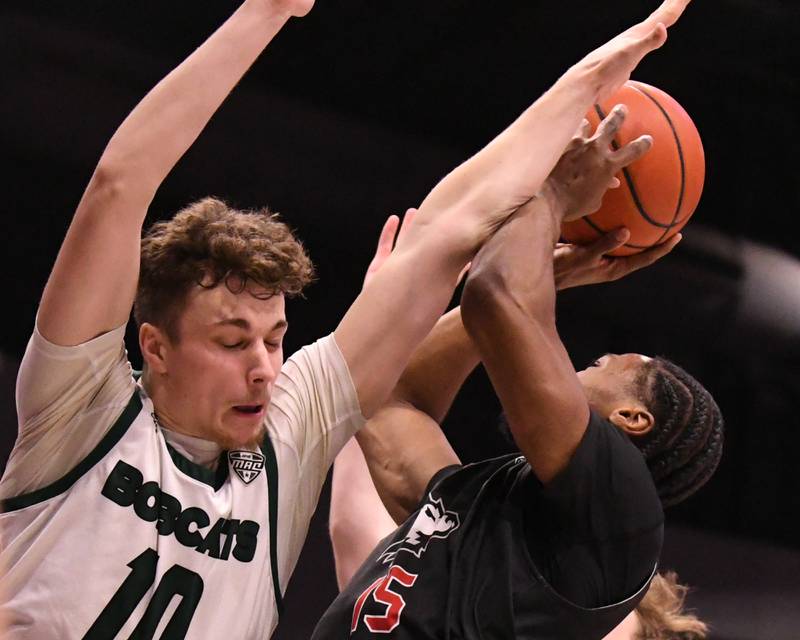 Northern Illinois’s Ethan Butler, right, gets fouled as he takes a shot in the second half by Ohio’s Aidan Hadaway during the game on Saturday Feb. 24, 2024, at The Convocation Center in DeKalb.