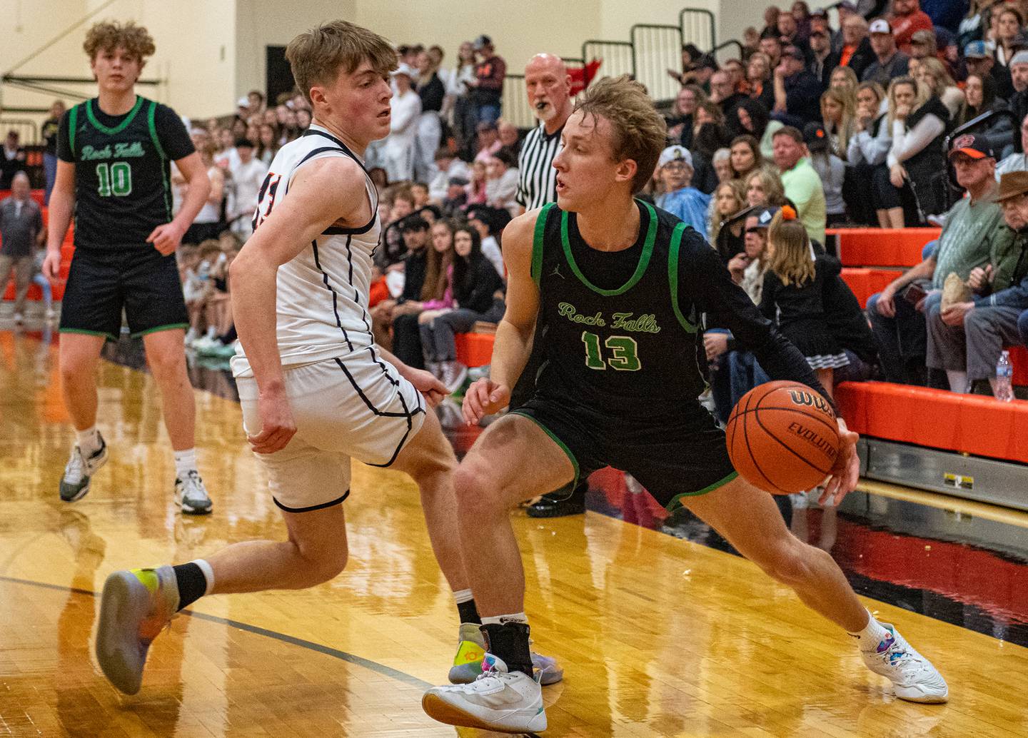 Rock Falls' Aydan Goff drives to the basket past Byron's Jack Hiveley during the third quarter of the 2A Byron Regional championship game on Saturday, Feb. 25, 2023.