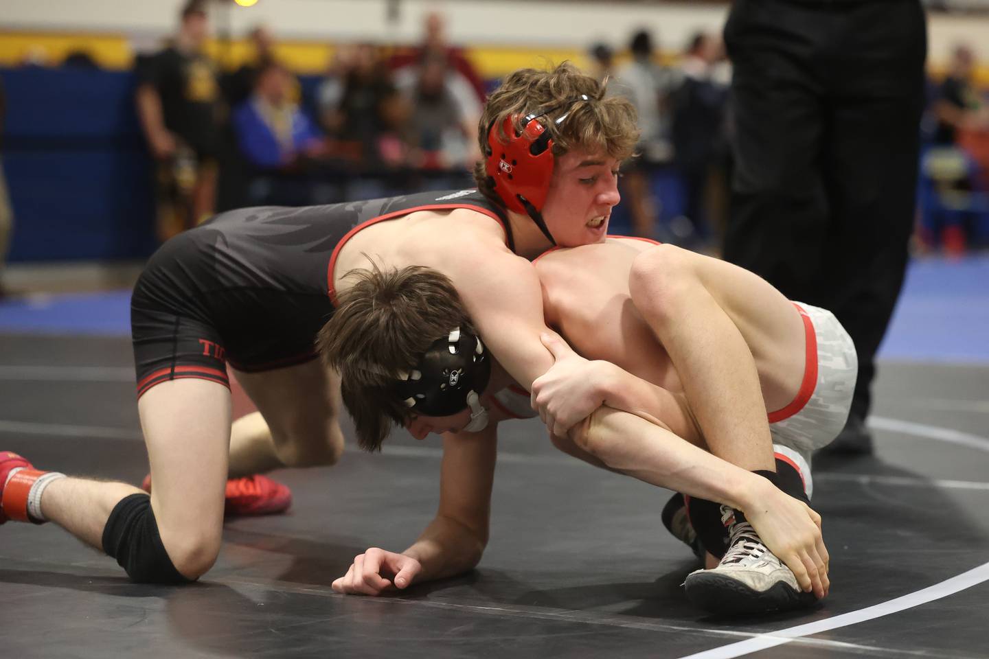 Plainfield North’s Maddox Garbis works over Yorkville’s Liam Fenoglio in the Southwest Prairie Conference 113 pound Championship at Joliet Central on Saturday, Jan. 20th, 2024.