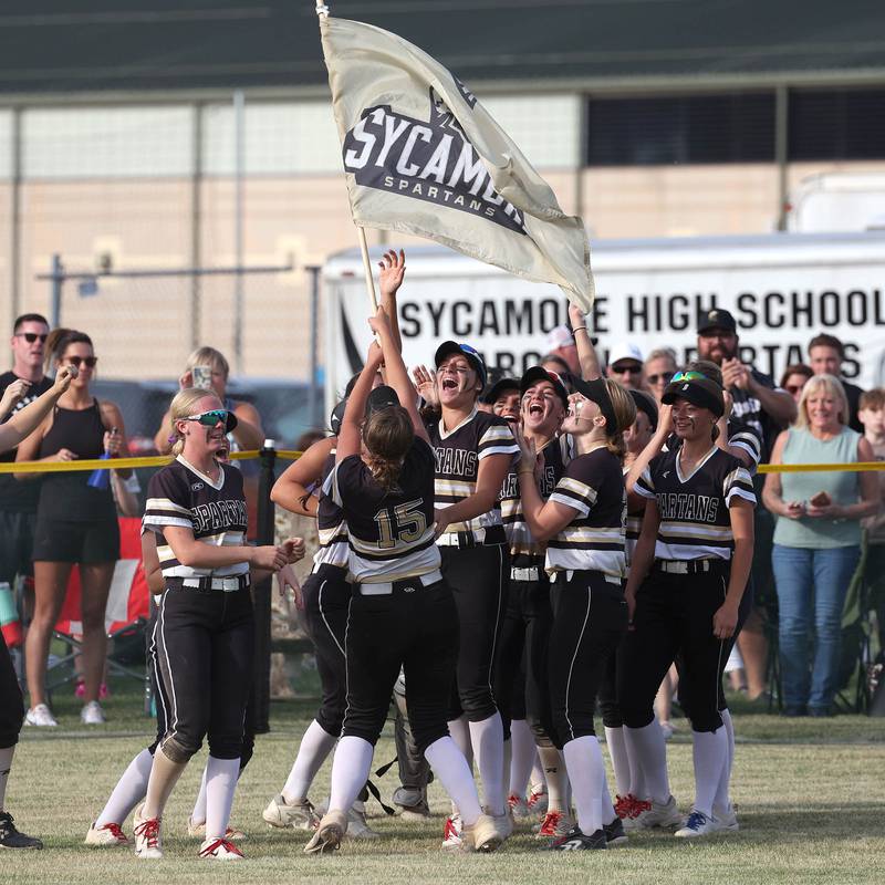 Sycamore players celebrate after winning the Class 3A sectional final over Prairie Ridge Friday, May 31, 2024, at Sycamore High School.