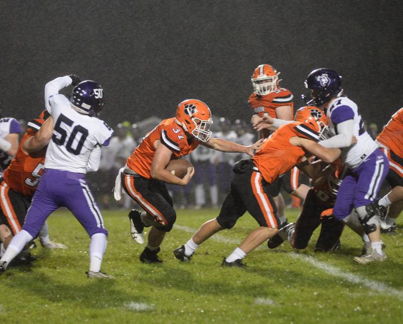 Byron's Caden Considine (37) follows a blocker through the line en route to touchdown during first quarter action against Dixon on Friday, Oct. 13, 2023 at Byron's Everett Stine Field.