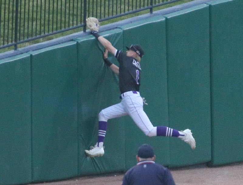 Wilmington's Jake Castle leaps on the wall in foul territory but misses the catch against St. Anthony during the Class 2A semifinal game on Friday, May 31, 2024 at Dozer Park in Peoria.