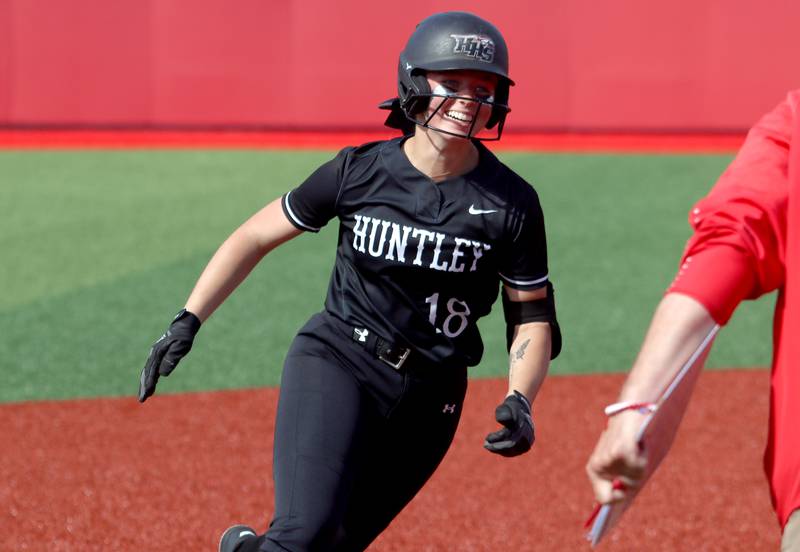 Huntley’s Meghan Ryan rounds the bases on her home run against Barrington in sectional final softball  action at Barrington Friday.