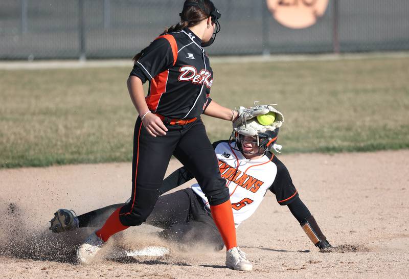 Sandwich's Hannah Decker slides into second ahead of the tag of DeKalb's Emma Hart during their game Tuesday, March 19, 2024, at DeKalb High School.