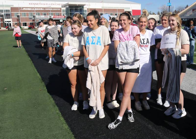 Participants nervously wait in 23 degree air temperatures Saturday, Feb 17, 2024, for their chance to jump into the water during the Huskie Stadium Polar Plunge at Northern Illinois University in DeKalb. The Polar Plunge is the signature fundraiser for Special Olympics Illinois.