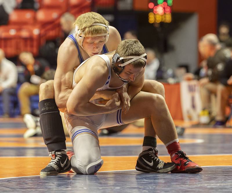 Sterling Newman Central’s Daniel Kelly control Hoopston’s Ayden Larkin in the 157 pound 1A fifth place match Saturday, Feb. 17, 2024 at the IHSA state wrestling finals at the State Farm Center in Champaign.