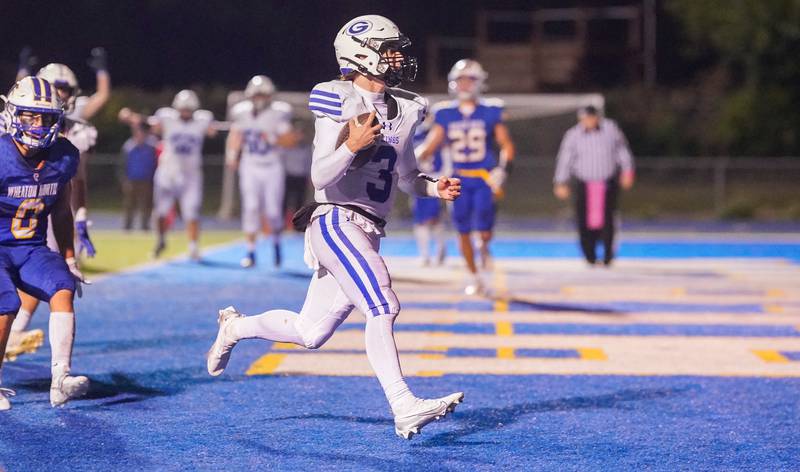 Geneva’s Nate Stempowski (3) carries the ball for a touchdown against Geneva during a football game at Wheaton North High School on Friday, Oct. 6, 2023.