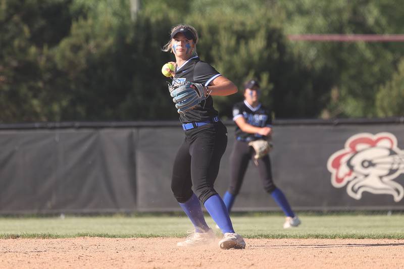 Lincoln-Way East’s Maddie Henry checks the runner at first against Lincoln-Way Central in the Class 4A Lincoln-Way Central Sectional semifinal on Wednesday, May 29, 2024 in New Lenox.